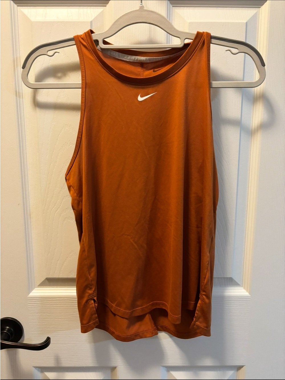 Nike Women's Rust Orange Athletic Tank Top with White Swoosh